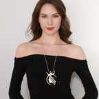 Gold plated statement necklace with large crown pendant