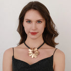 Gold plated statement necklace with large flower pendant