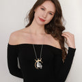 Gold plated statement necklace with large crown pendant