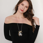 Gold plated statement necklace with large crown pendant