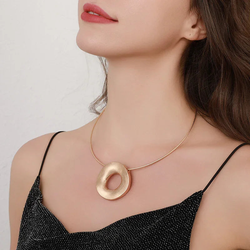 Gold plated statement necklace with large circle pendant