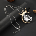 Gold plated statement necklace with large crown pendant