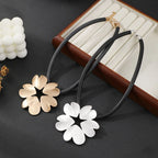 Gold plated statement necklace with large flower pendant