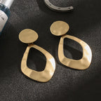 Trendy clip on 3 1/4" large matte gold or silver hammered wide cutout odd shaped earrings - CIVIBUY