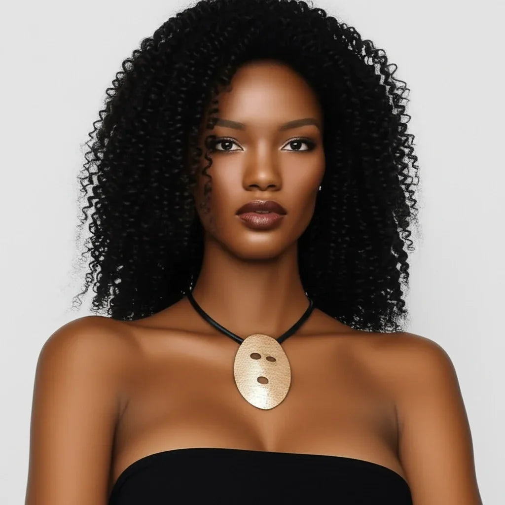 Woman with styled hair wearing a necklace on a plain background