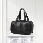 Minimalist black braided leather handbag with box shape and double handles
