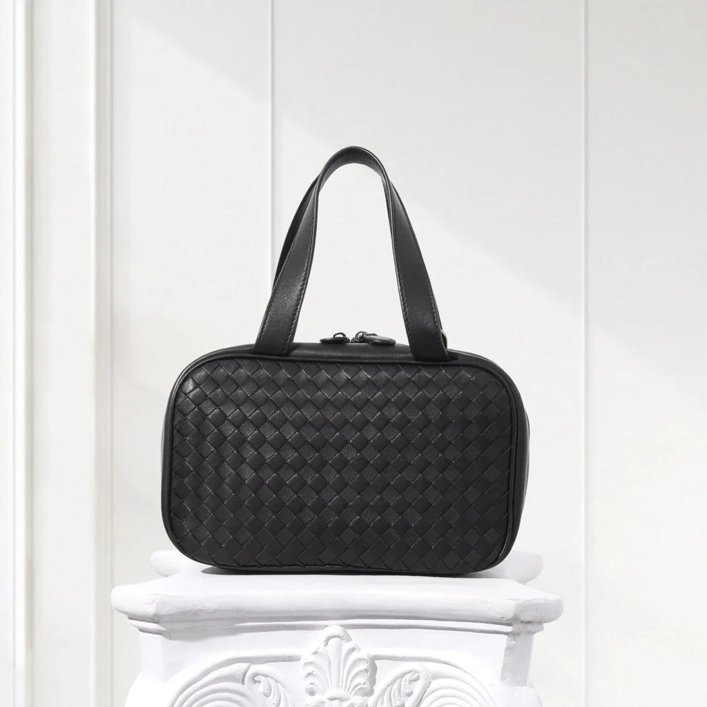 Front view of handcrafted black woven leather tote bag for women – minimalist box shape design