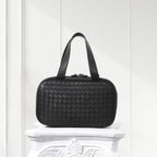 Front view of handcrafted black woven leather tote bag for women – minimalist box shape design