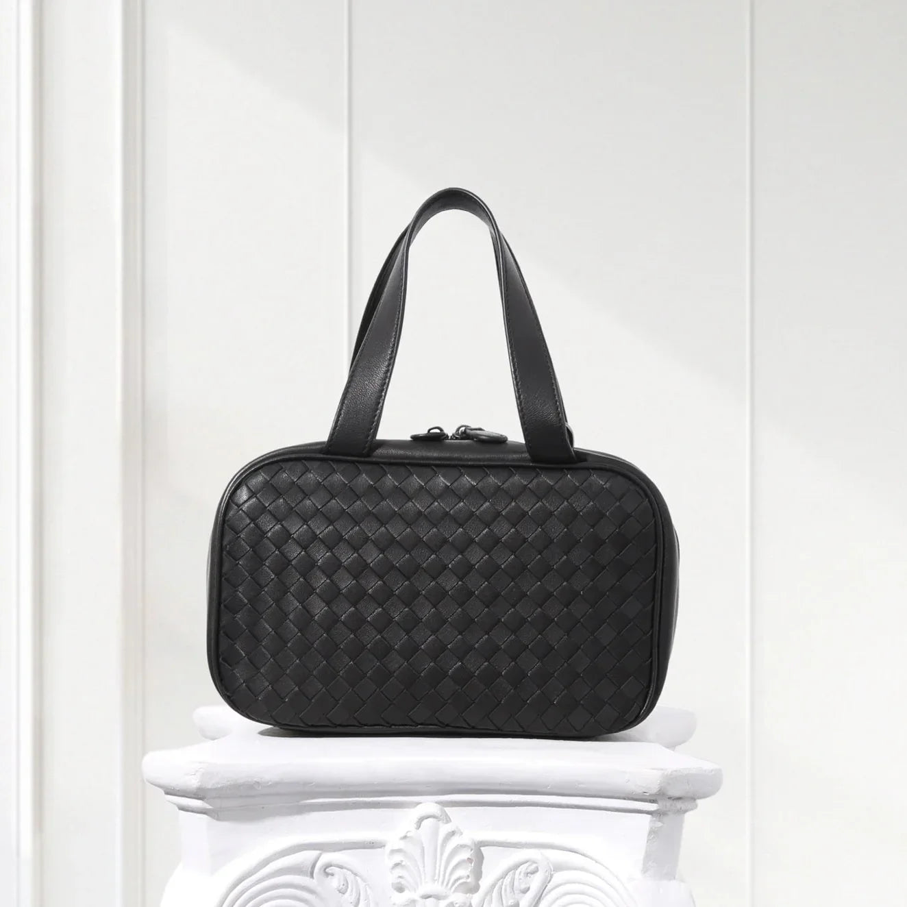 Front view of handcrafted black woven leather tote bag for women – minimalist box shape design