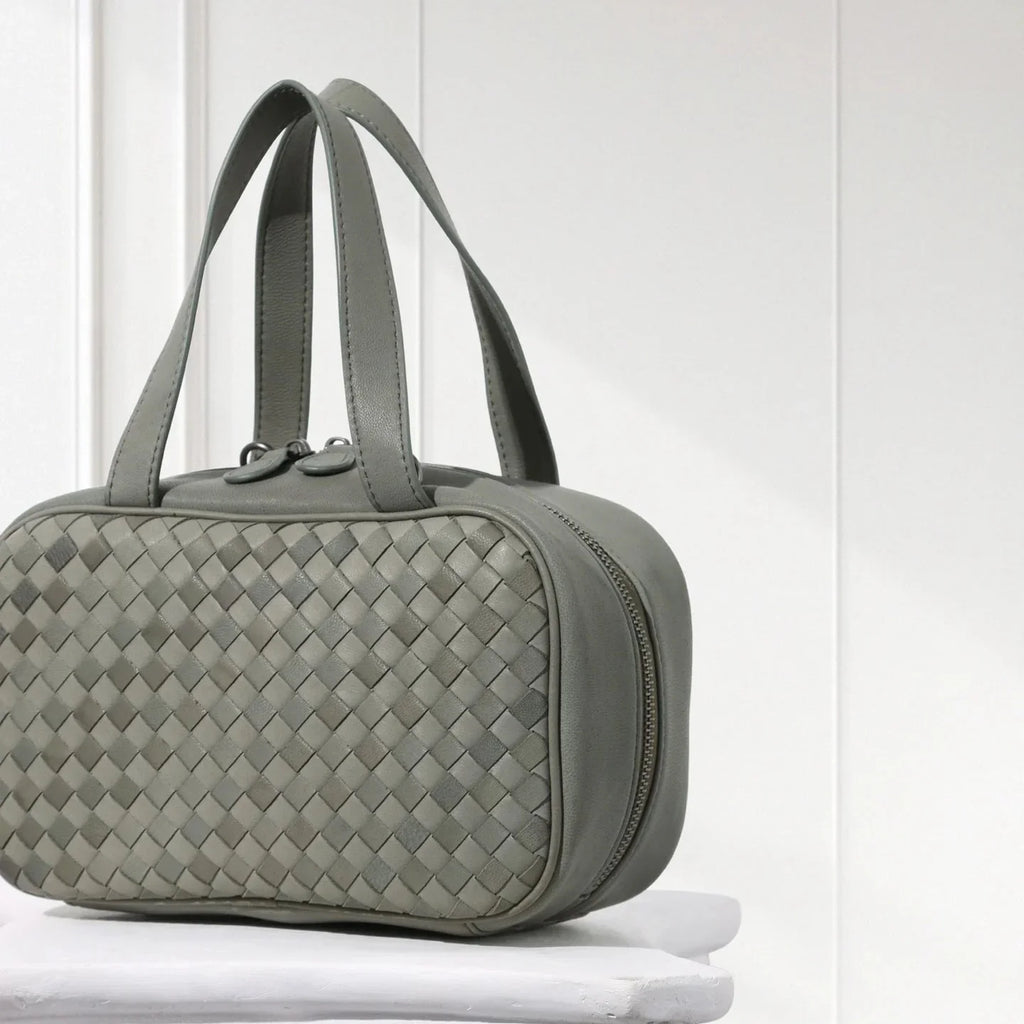 Side view of handcrafted hunter green woven leather tote – elegant minimalist design