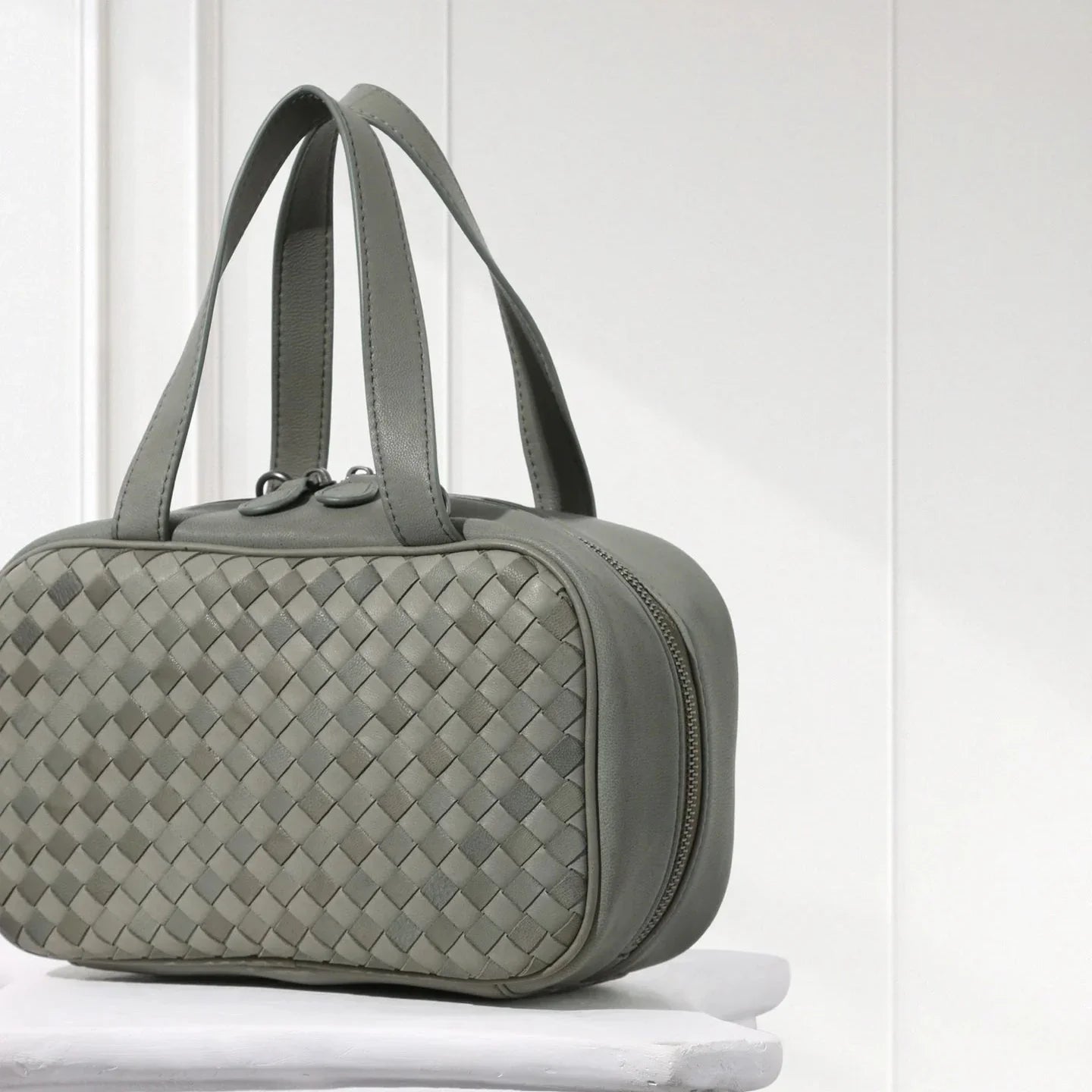 Side view of handcrafted hunter green woven leather tote – elegant minimalist design