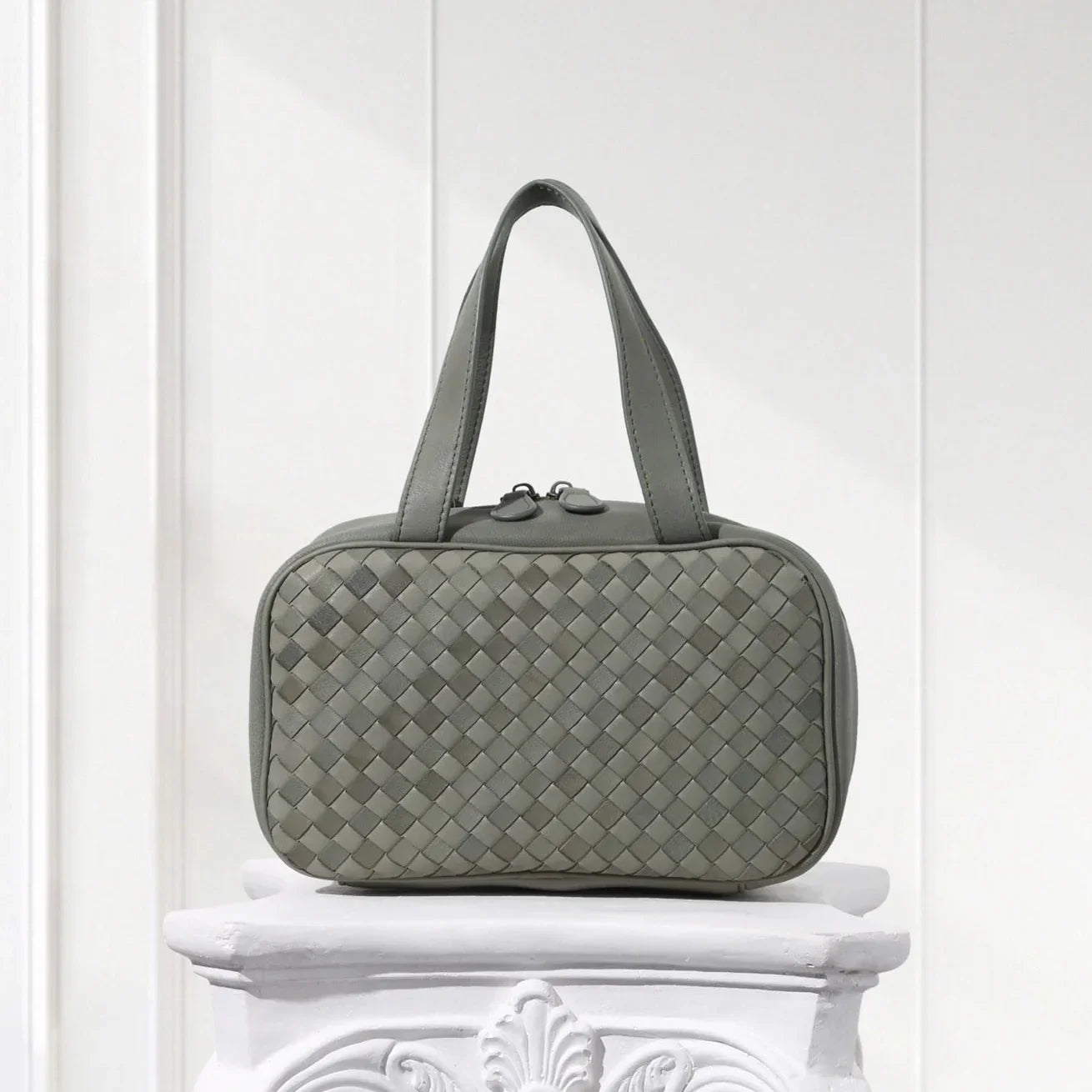 Front view of hunter green braided leather handbag for women – structured box tote design