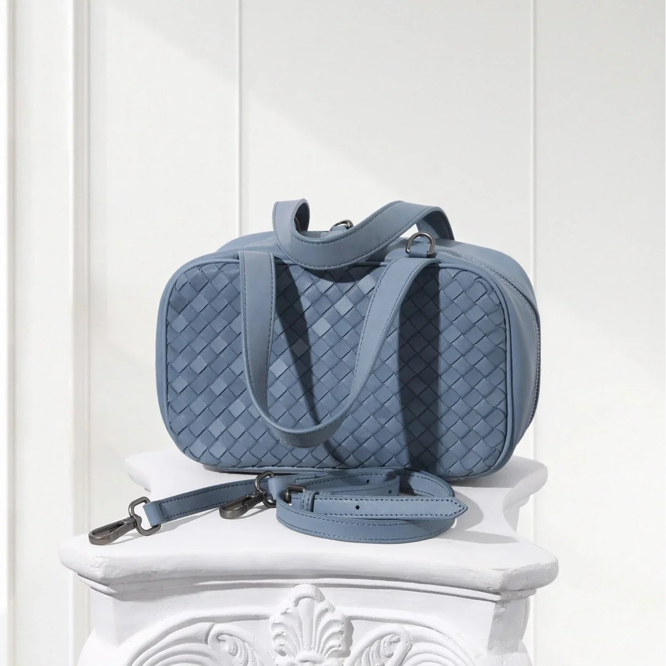 Back view of luxury blue leather braided tote bag made from genuine lambskin
