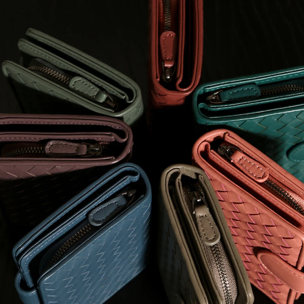 Handcrafted Nappa leather woven wallet in a rich earthy red-brown hue, showing a compact bi-fold design and premium textured