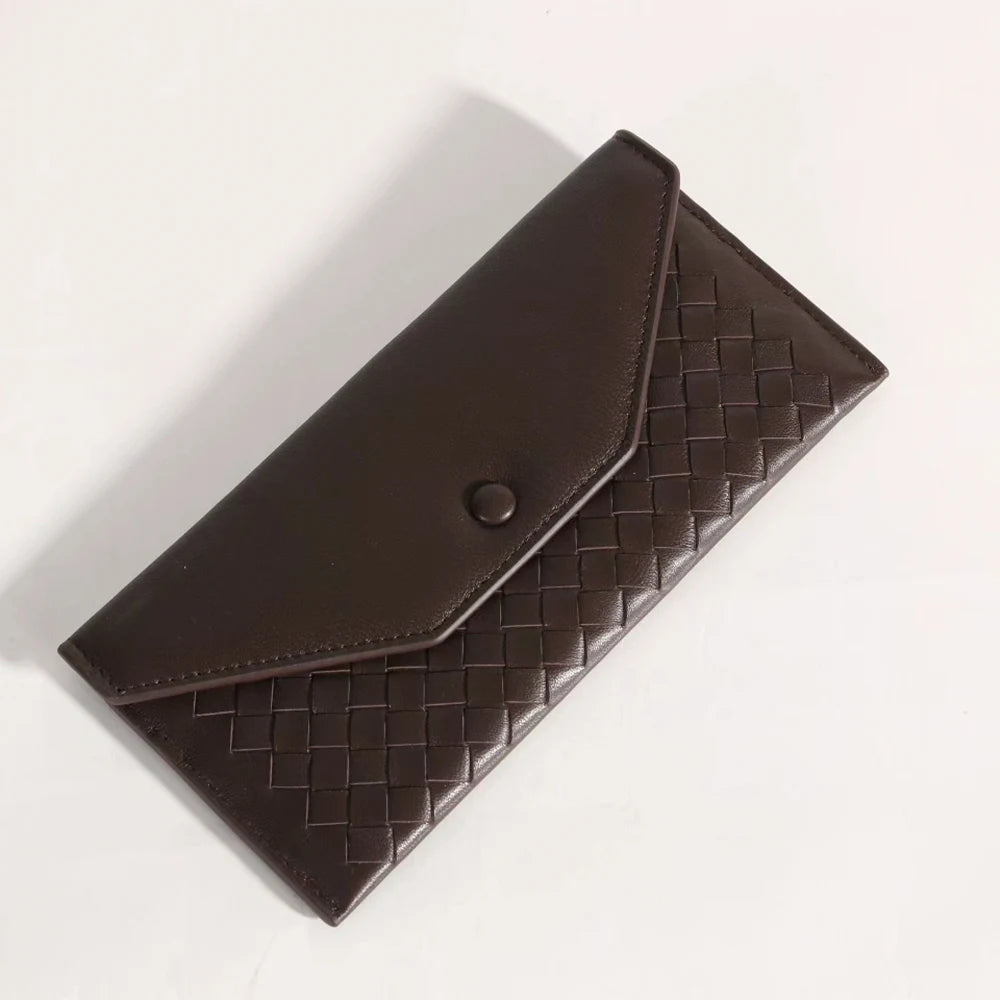 Brown woven leather wallet on a white background