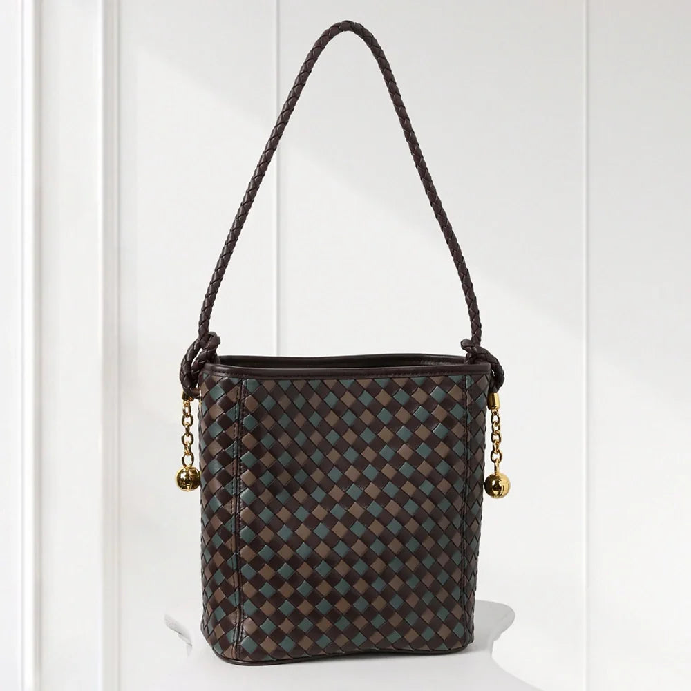 Brown checkered handbag with a rope handle on a white background