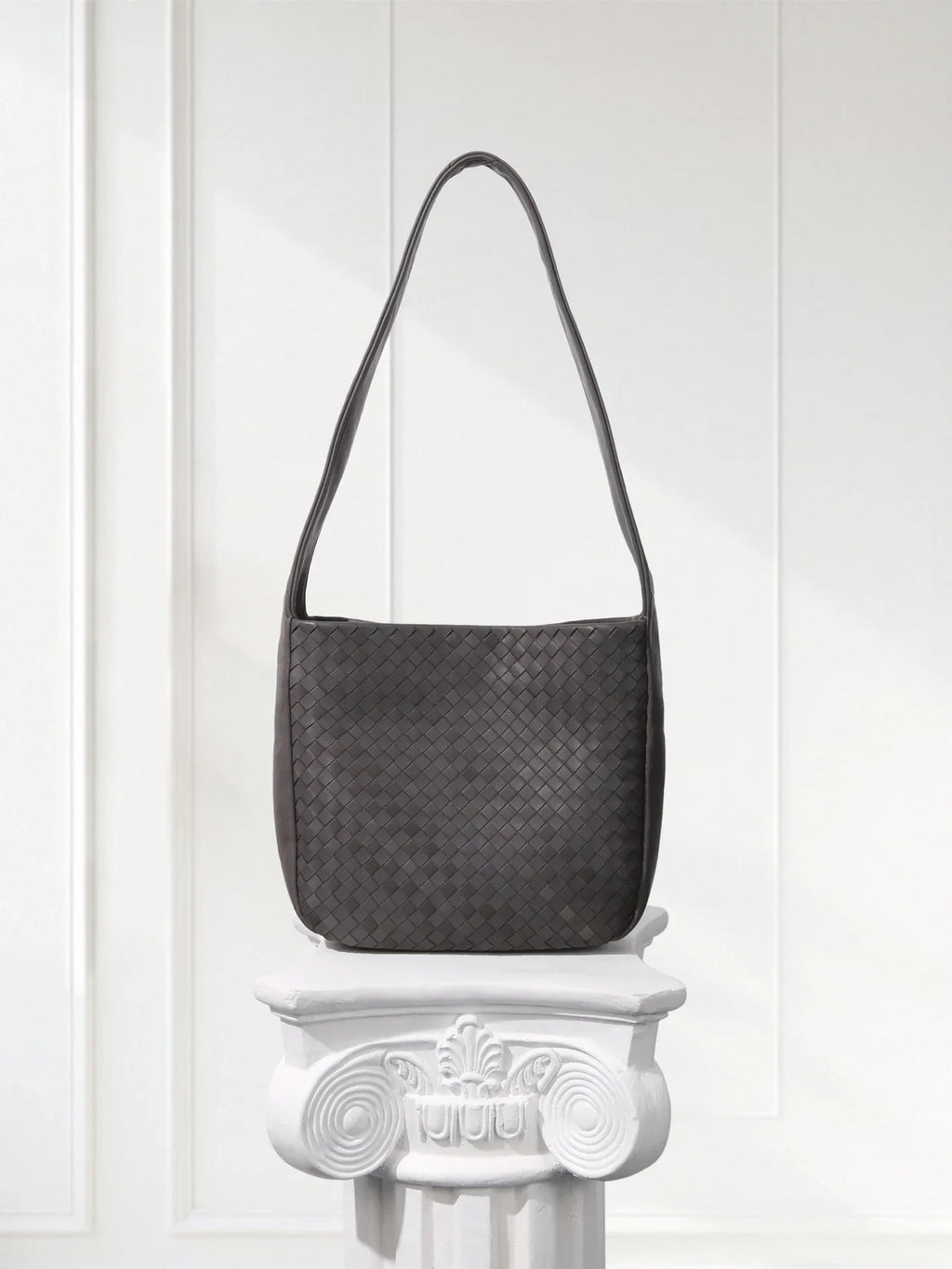 Side view of lightweight woven leather bag showing 60° alternating weave