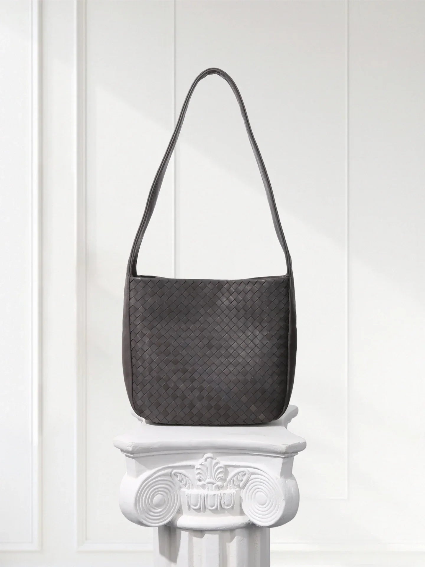 Side view of lightweight woven leather bag showing 60° alternating weave