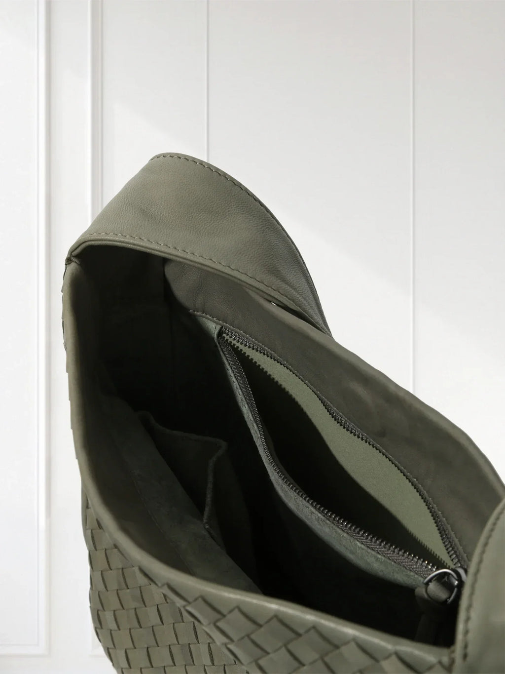 Close-up of aniline-dyed lambskin texture and edge-bound detailing