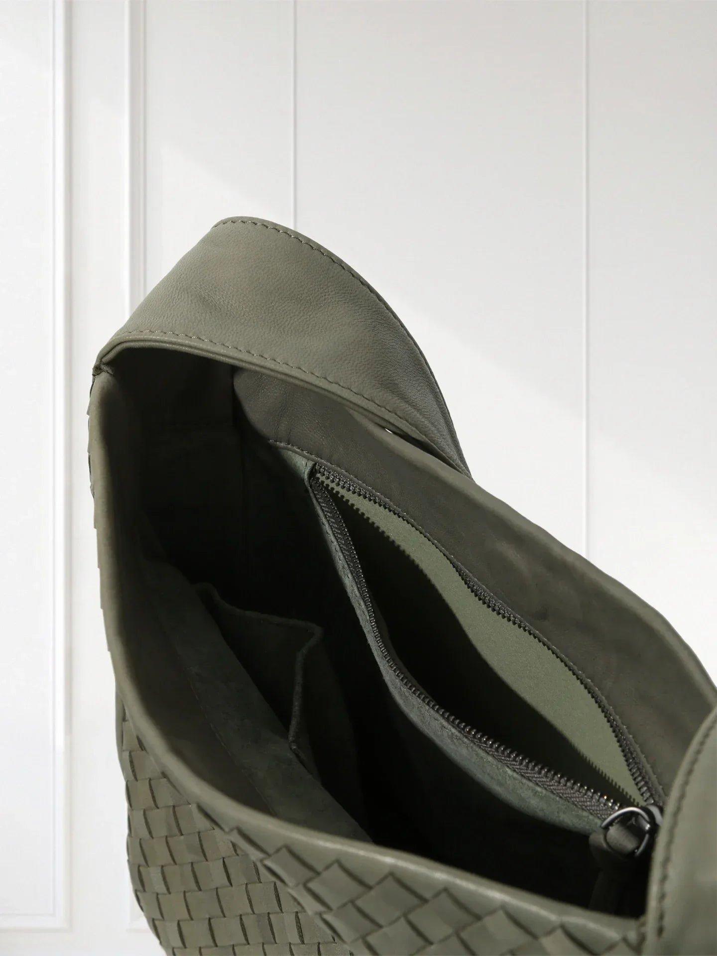 Close-up of aniline-dyed lambskin texture and edge-bound detailing