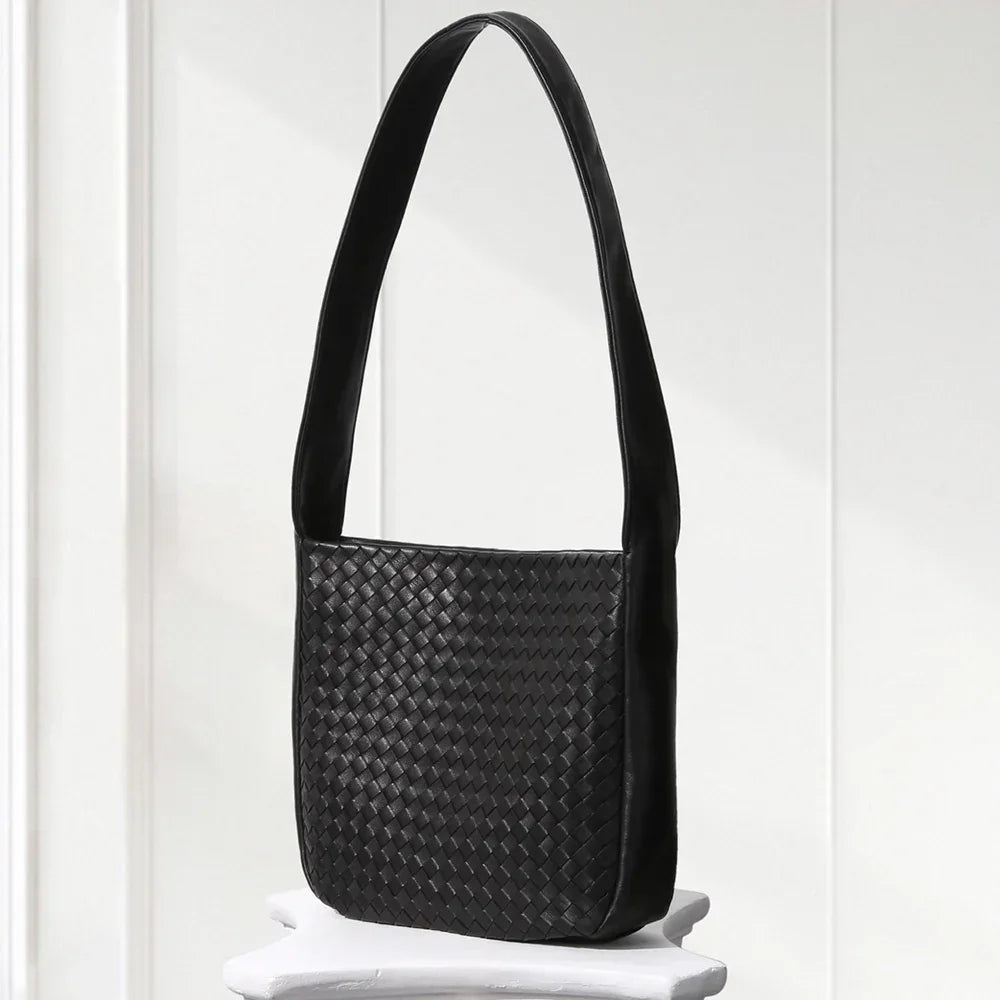 Close-up of aniline-dyed lambskin texture and edge-bound detailing