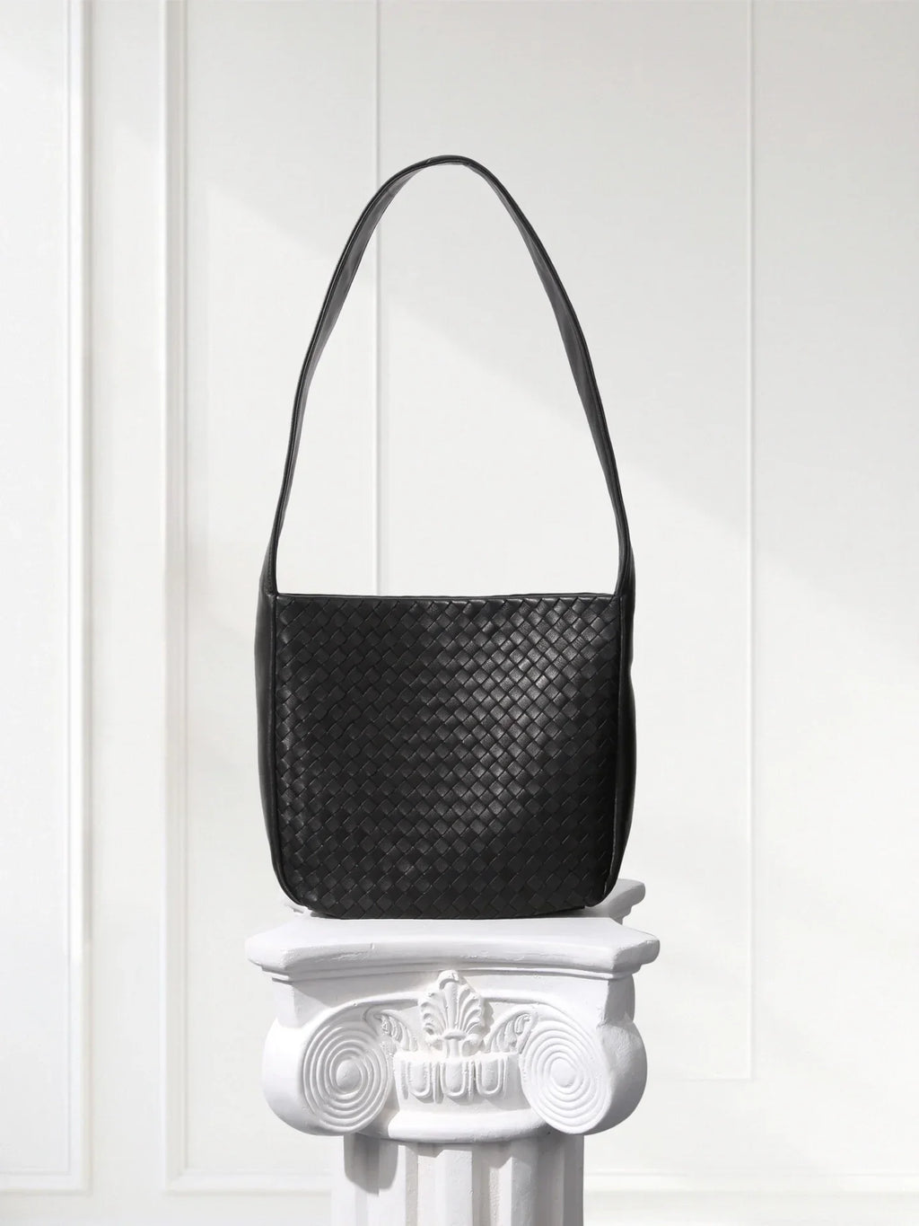 Close-up of aniline-dyed lambskin texture and edge-bound detailing