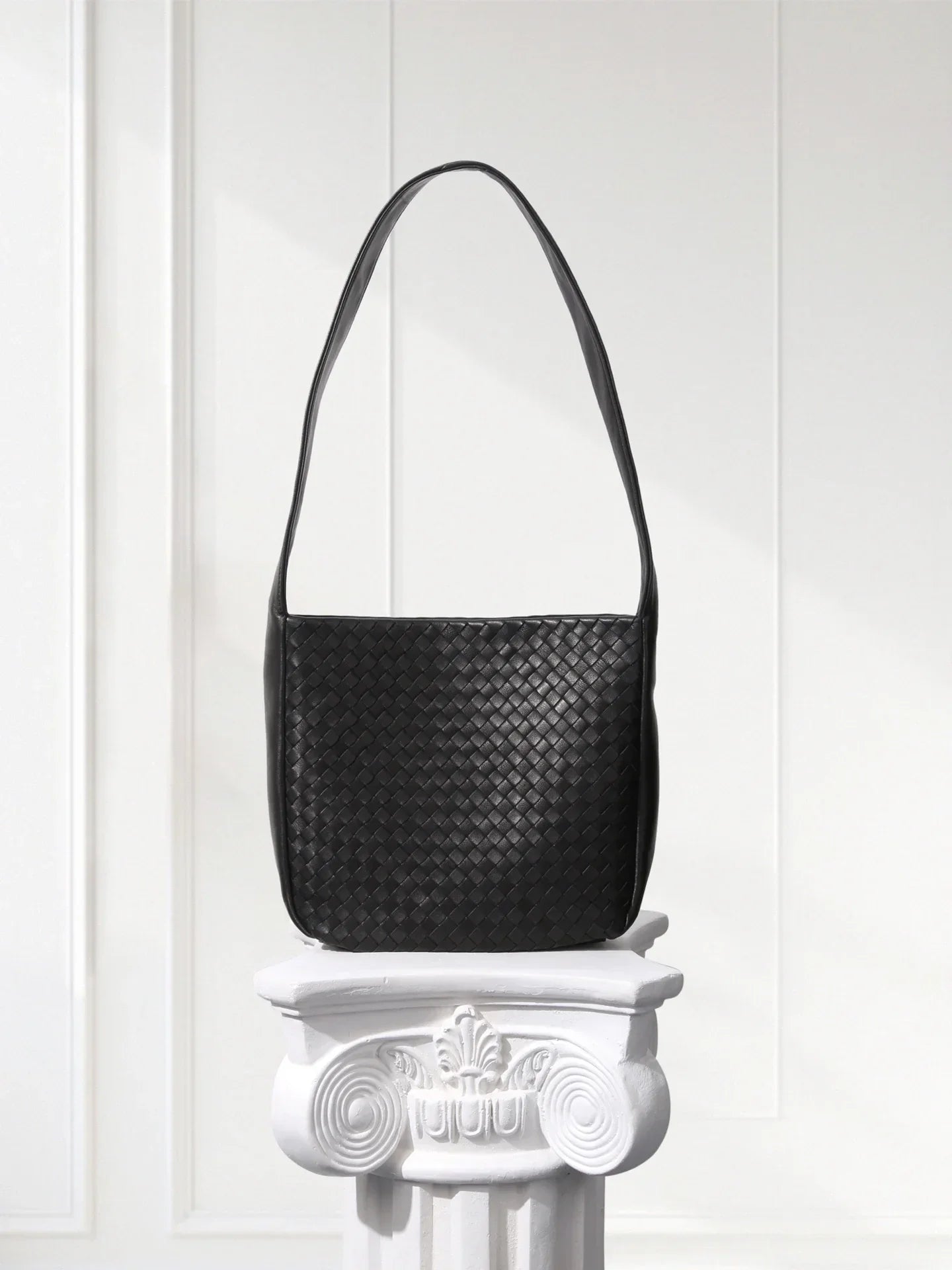 Close-up of aniline-dyed lambskin texture and edge-bound detailing