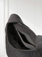 Side view of lightweight woven leather bag showing 60° alternating weave