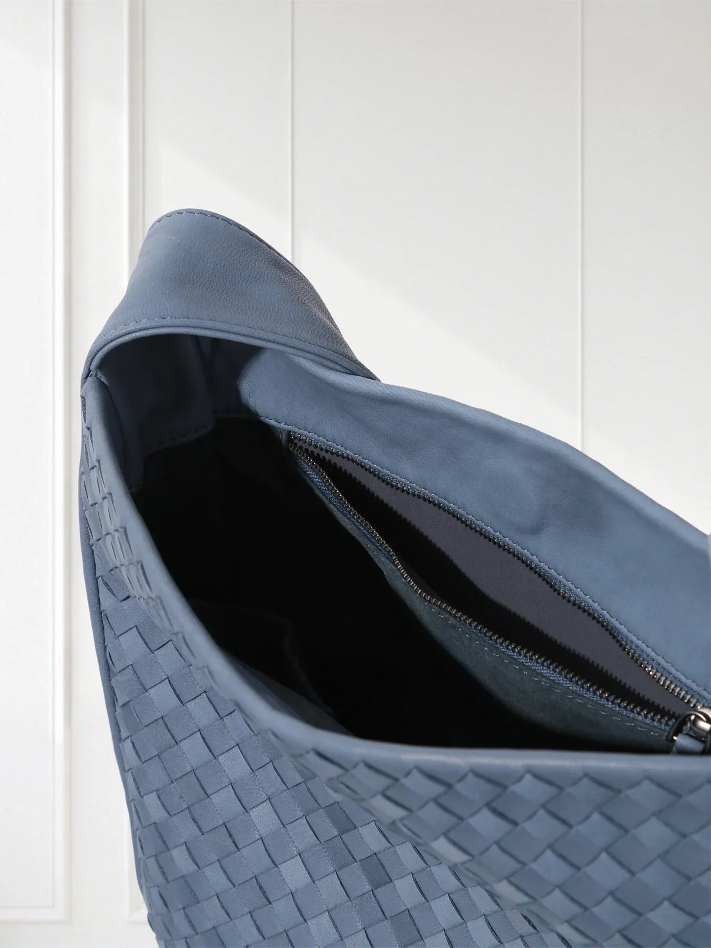 Side view of lightweight woven leather bag showing 60° alternating weave