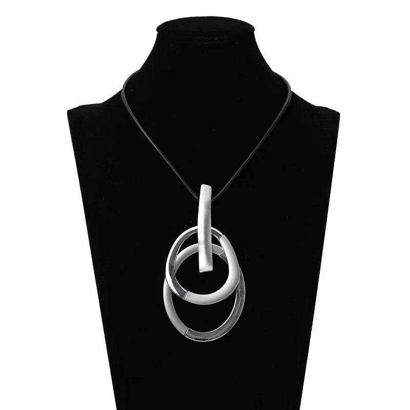 Modern Interlocking Silver Pendant Necklace – minimalist three-ring jewelry with black rubber cord | Civibuy wholesale near New York