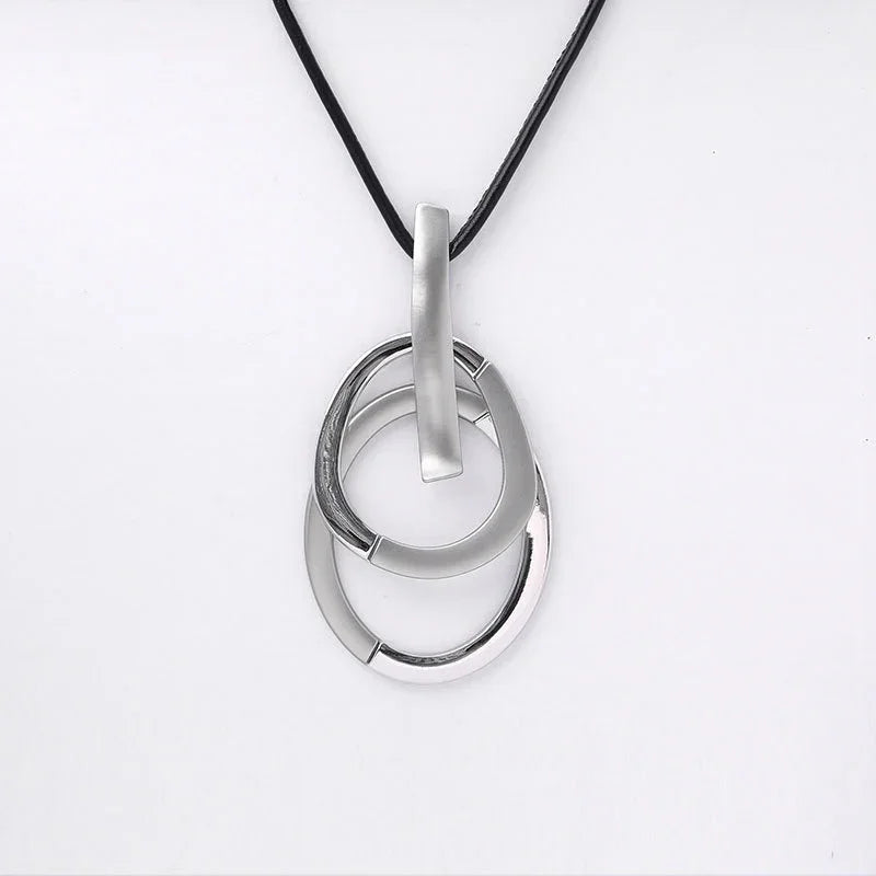 Modern Interlocking Silver Pendant Necklace – minimalist three-ring jewelry with black rubber cord | Civibuy wholesale near New York