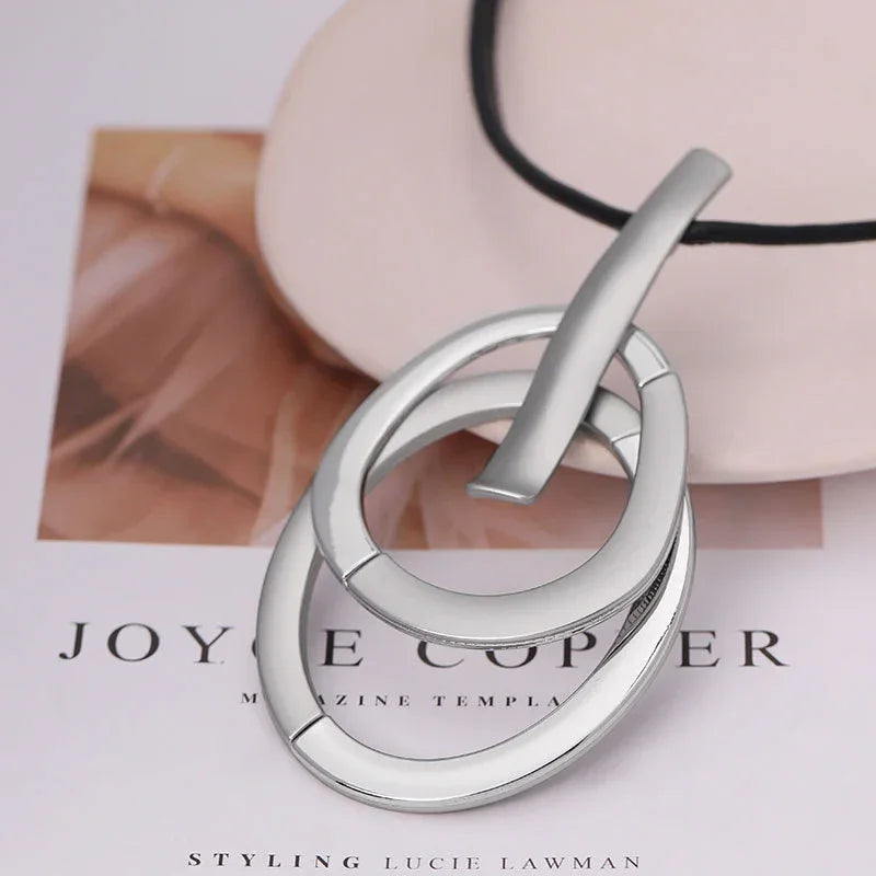 Modern Interlocking Silver Pendant Necklace – minimalist three-ring jewelry with black rubber cord | Civibuy wholesale near New York