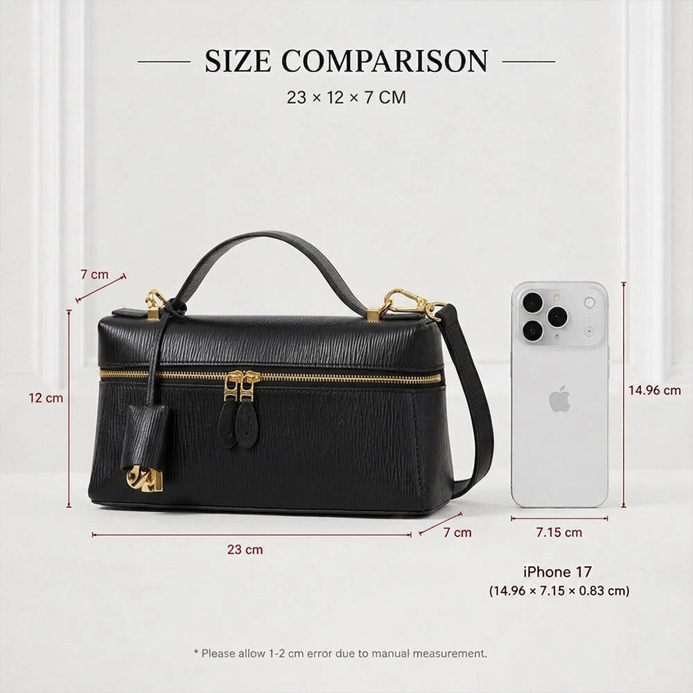 A black leather handbag with gold-tone hardware is shown with overlaid dimension lines and text reading 'SIZE COMPARISON alongside a white iPhone 17 measurement reference. This is an auxiliary informational image rather than a clean product hero shot, so subject_type is Measurement Chart.