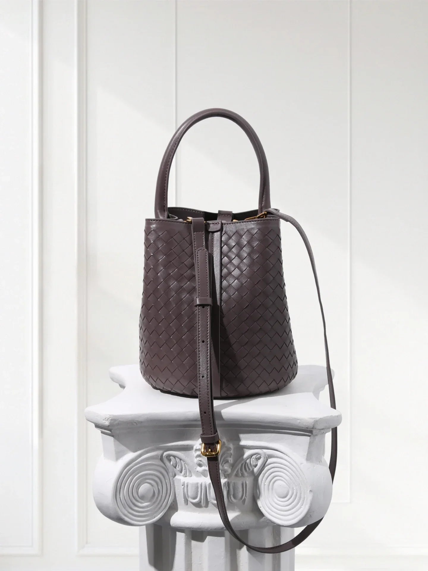 Handcrafted brown woven leather bucket tote with green suede inner bag, 100% lambskin