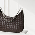 Mini Sling bag in woven carré leather with adjustable strap and zipper closure，brown
