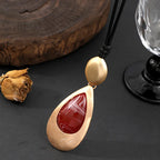 Elegant Teardrop Pendant Necklace with Golden Accent & Red Gemstone