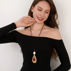 Elegant Teardrop Pendant Necklace with Golden Accent & Red Gemstone