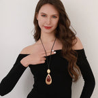 Elegant Teardrop Pendant Necklace with Golden Accent & Red Gemstone