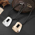 Modern Abstract Pendant Necklace with Geometric Cutout – Gold Finish