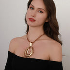 Elegant Gold Swirl Pendant on Leather Cord Necklace