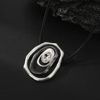 Futuristic Layered Pendant Necklace with Clear Crystal Center – Silver & Black Tones