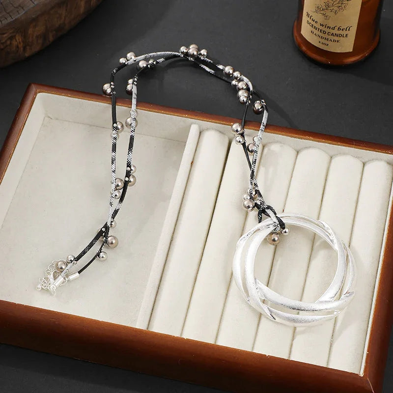 Gold Interlocking Circle Pendant Necklace with Beaded Accents