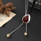 Modern Boho Statement Necklace with Red Resin Pendant and Adjustable Leather Cord