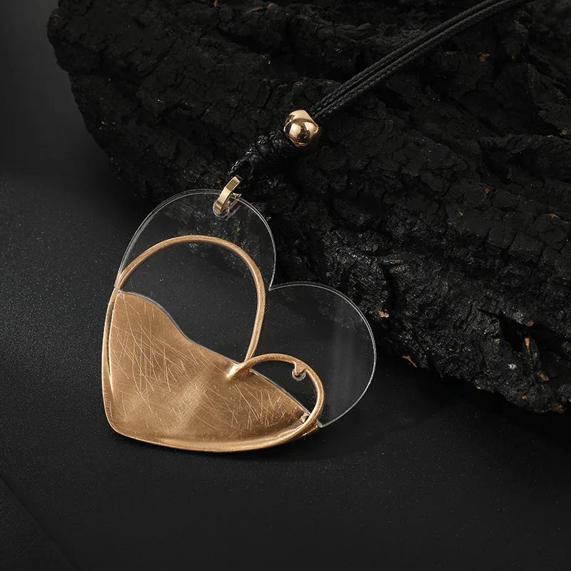 Luxe Fusion: Transparent Heart with Golden Touch Artisan Heart Pendant