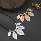 Necklace with leaf-shaped pendants on a dark surface