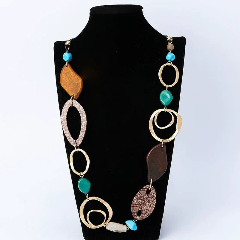 Necklace with various shaped beads on a black mannequin against a white background Wholesale available near CA, US on Civibuy.com.