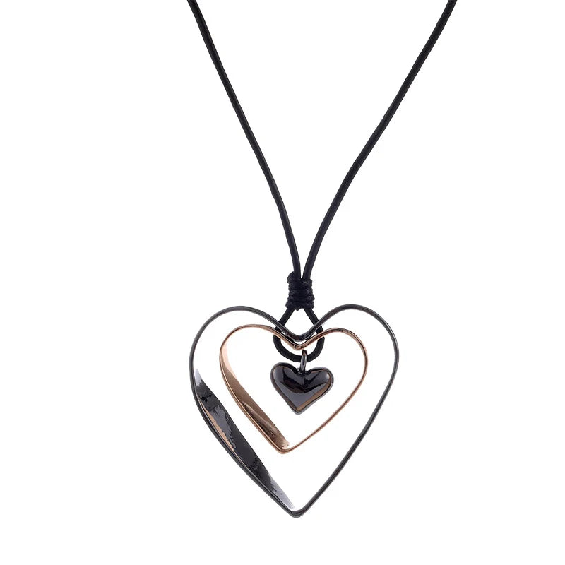 Heart-shaped necklace with three interlocking hearts on a white background