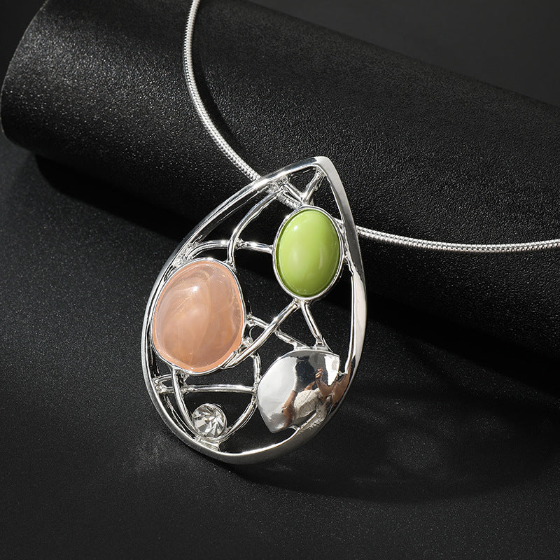 Elegant Silver Statement Necklace – Abstract Teardrop Pendant with Gemstones