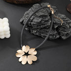 Gold plated statement necklace with large flower pendant