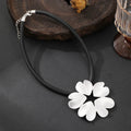 Gold plated statement necklace with large flower pendant